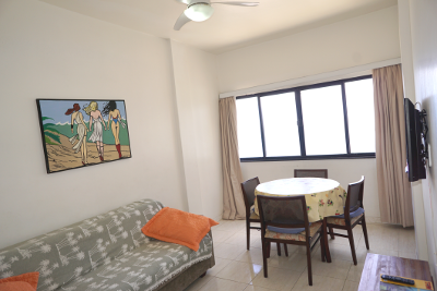 living room with television and sofa bed